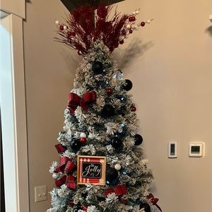 Packing up all items on tree (bulbs, signs, topper, ribbon). NOT THE TREE